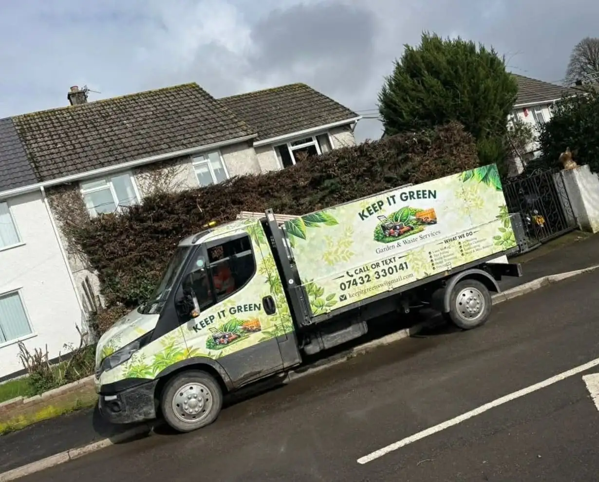 The Keep It Green tipper parked on a residential street in Plymouth, ready to load